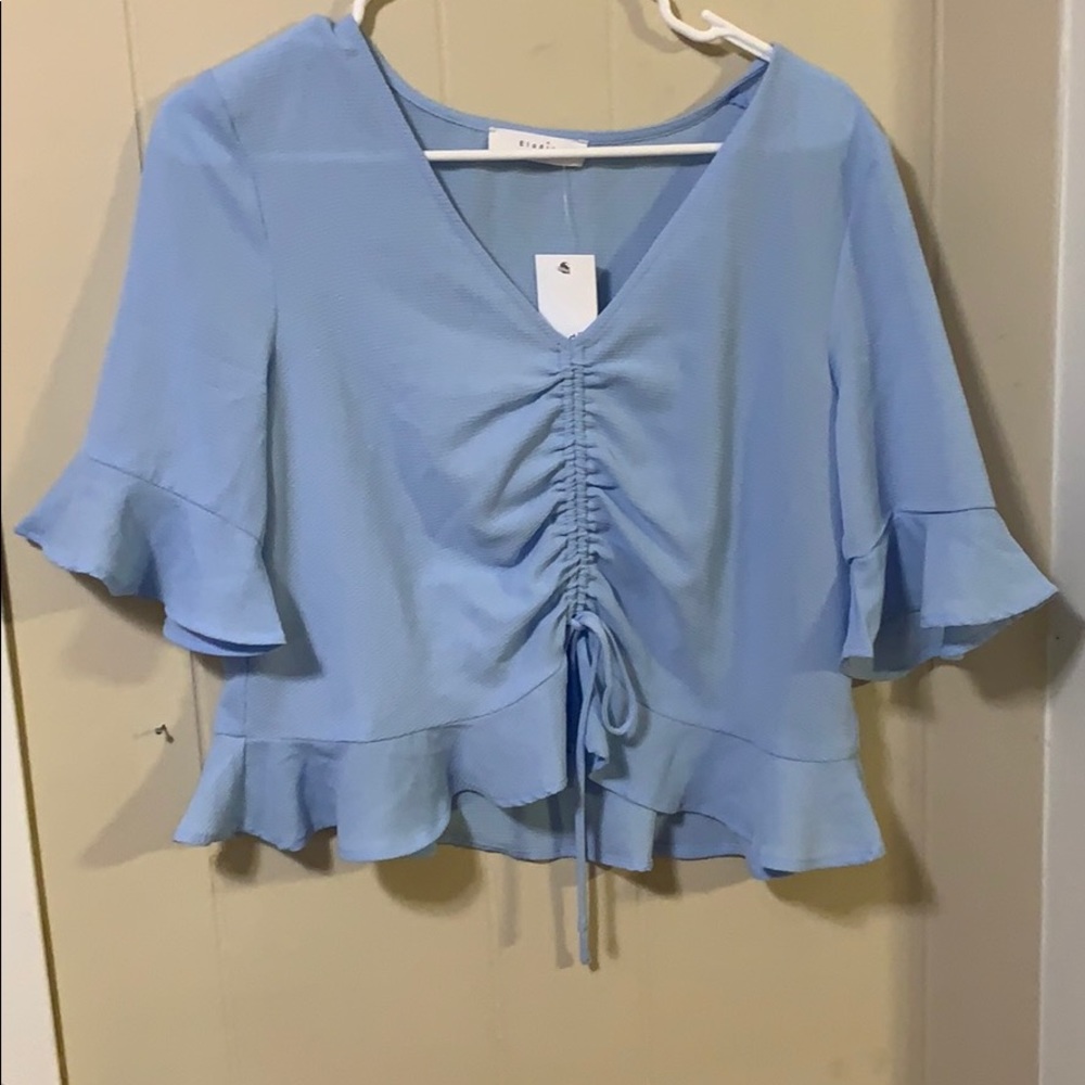 Light blue top
